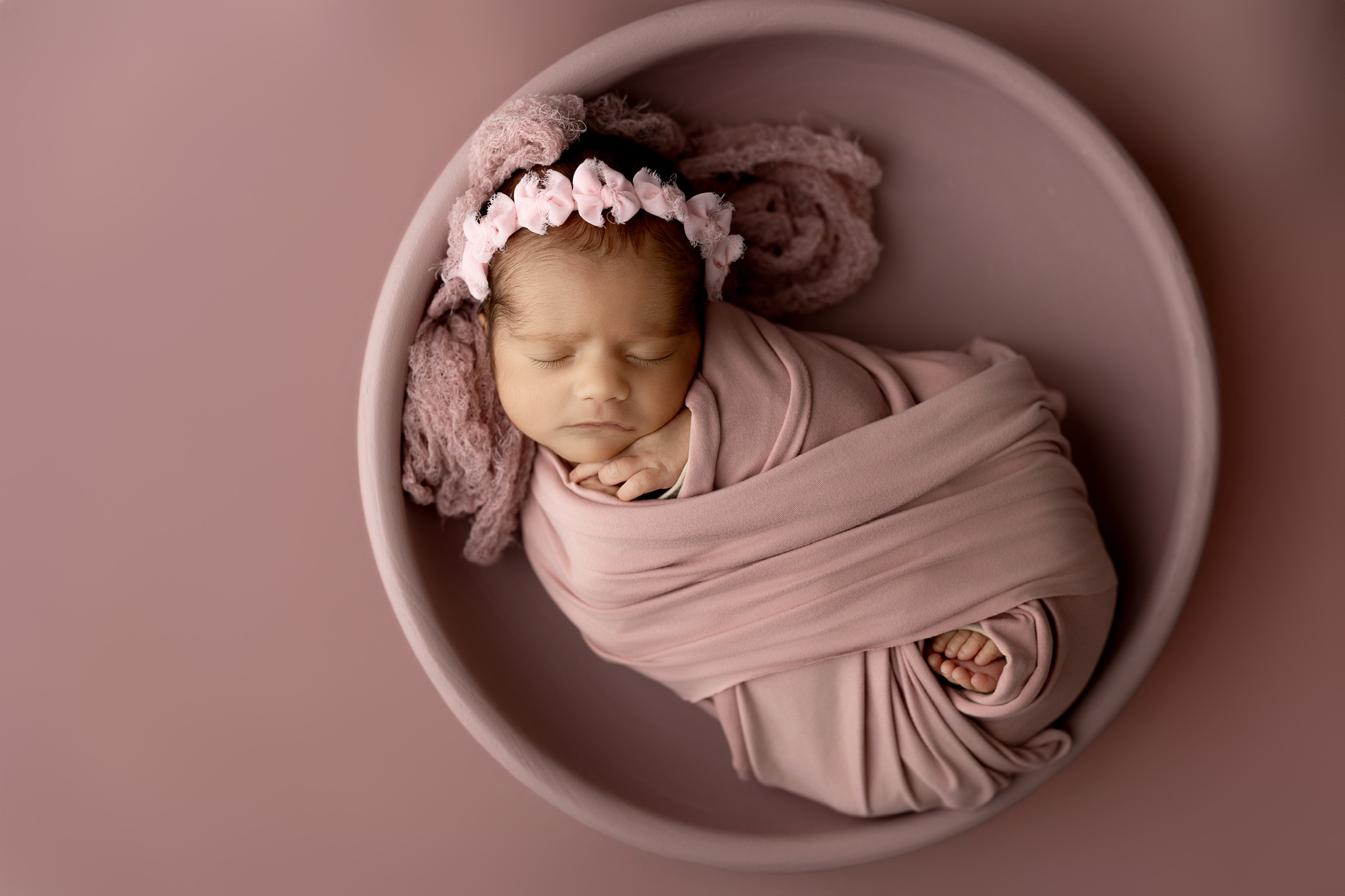 Newborn photography Appleton WI - baby girl in dusty rose wrap, round bowl, overhead portrait