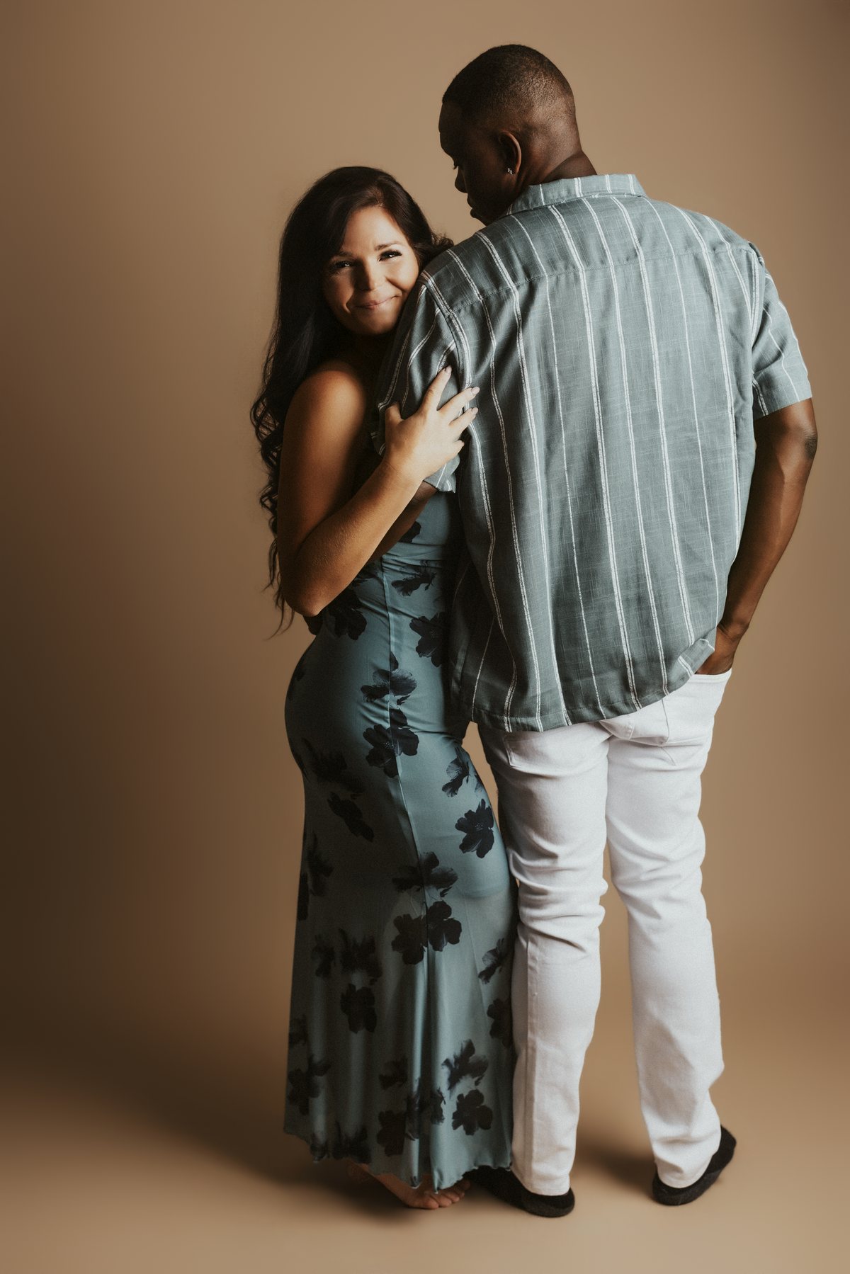 Tampa FL couples session, standing portrait on a warm tan backdrop
