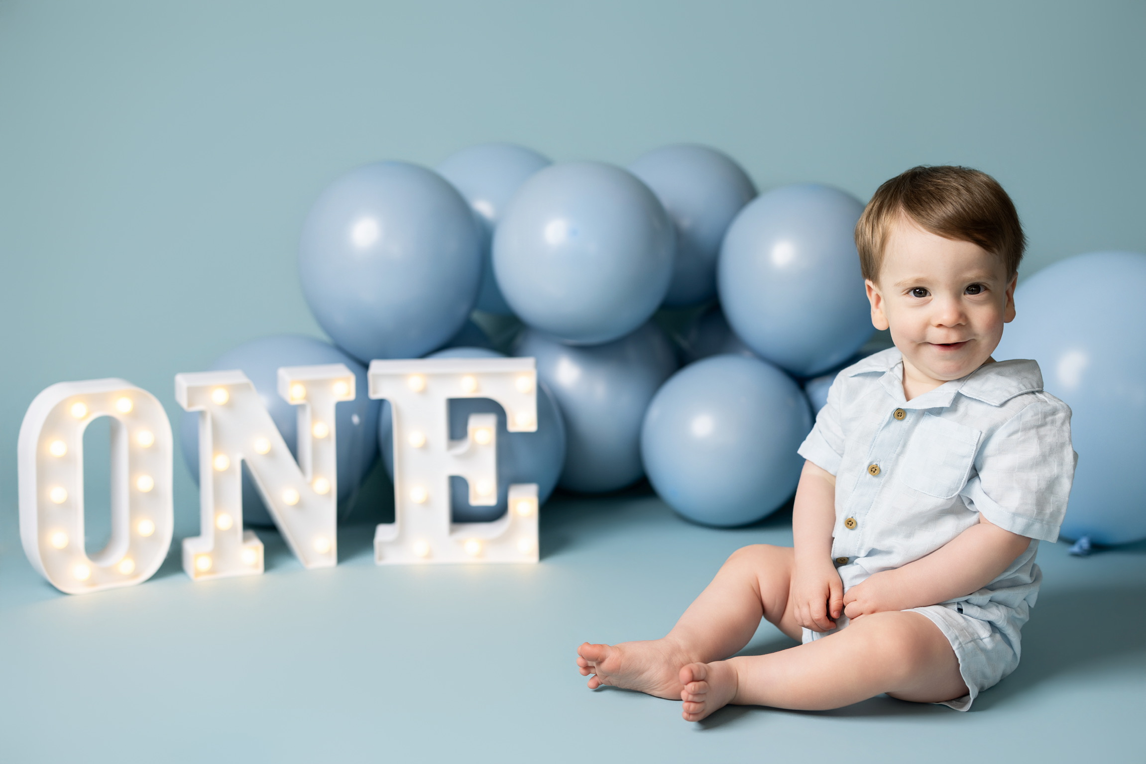Cake smash session Tampa FL colorful birthday theme